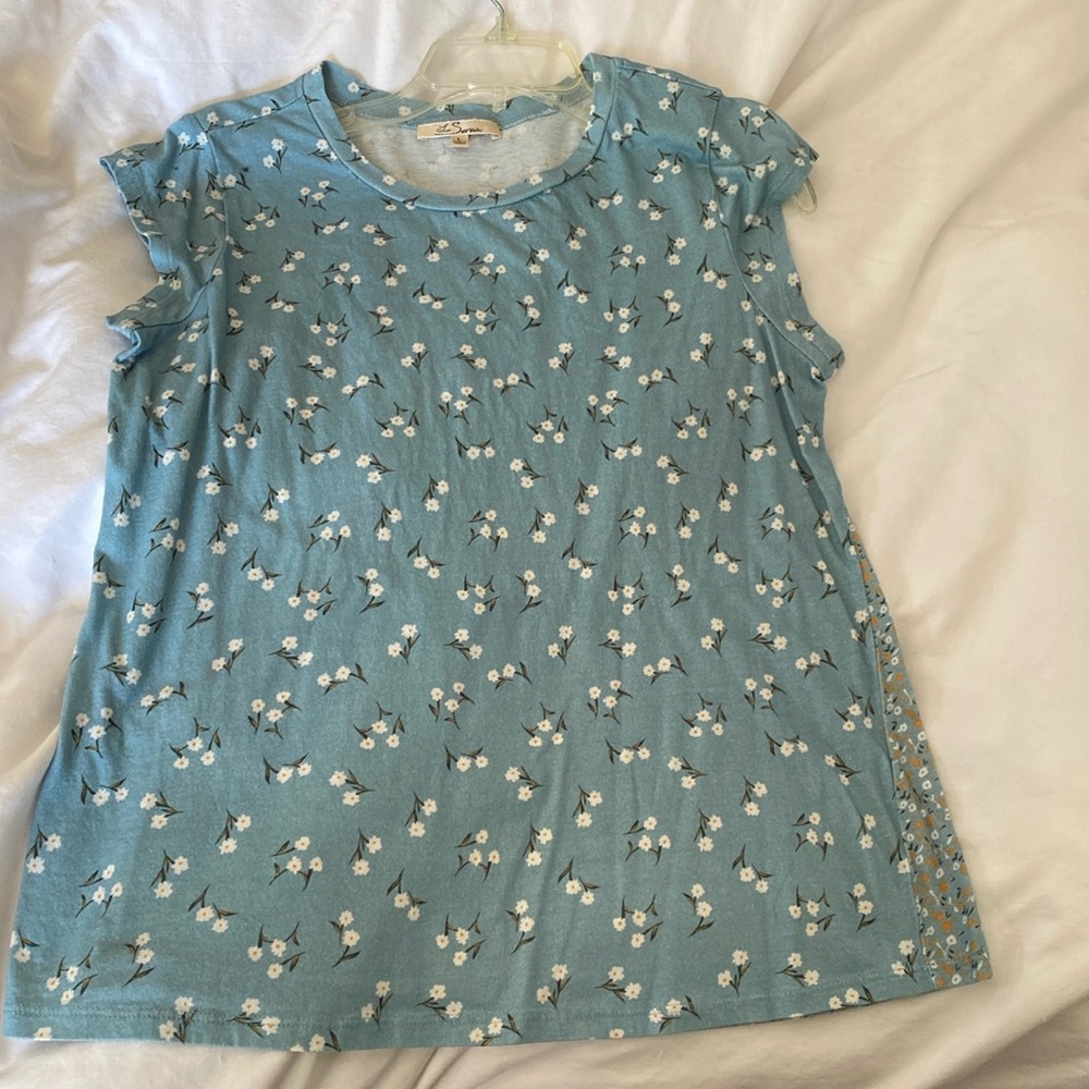 Periwinkle blue your thing?? Don’t miss this cute top!!